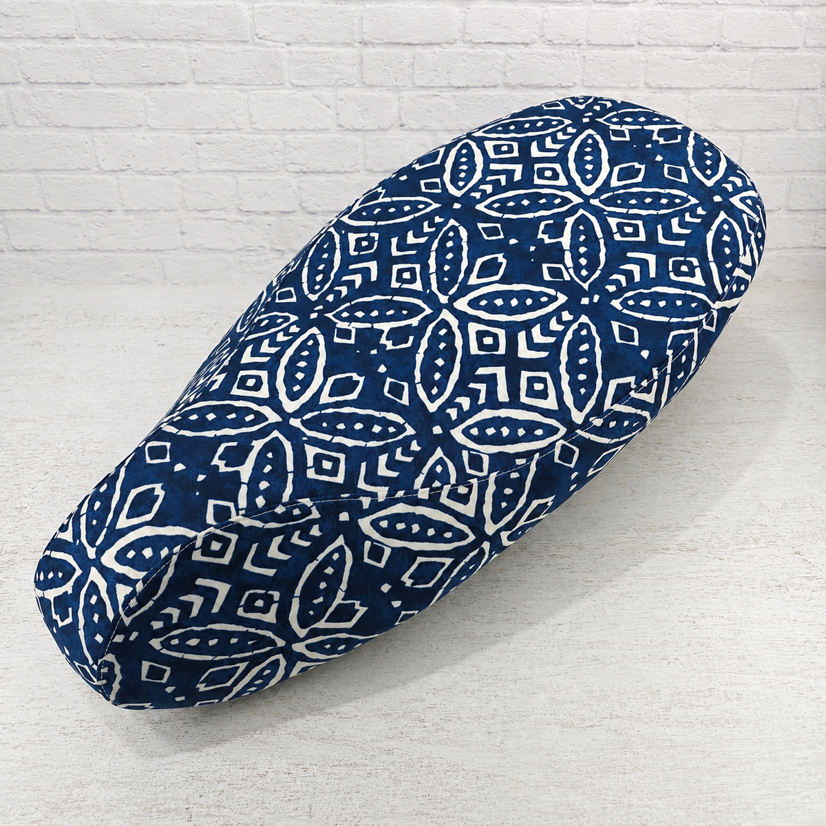 Indigo Boho stay-cool scooter seat cover with a relaxed geometric batik pattern for Vespa and other models, handmade by Cheeky Seats.