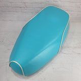 Turquoise Genuine Buddy Kick 125 seat cover with cream piping, handmade by Cheeky Seats