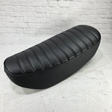 Black-on-black tuck-and-roll Honda DAX 125 seat cover with matching stitching and piping, handmade by Cheeky Seats