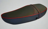 Matte black Vespa S and LX touring-saddle seat cover with red piping and matching strap, handmade by Cheeky Seats