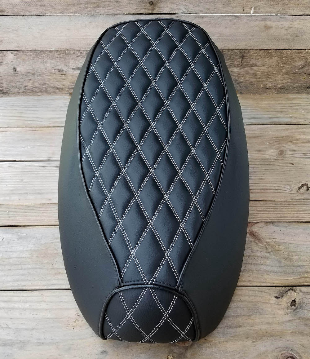 Top view of the Black Double Diamond Yamaha Vino 125 seat cover showing the full white-stitched quilt pattern, handmade by Cheeky Seats.